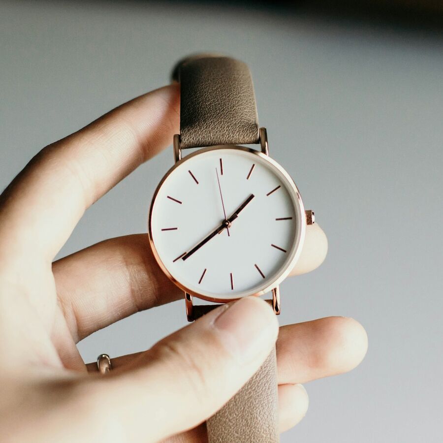 A minimal dial, held to the light